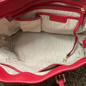 Red Michael Kors hand bag